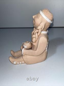 NATIVE AMERICAN INDIAN A. Q. SIGNED STORYTELLER Holding Pottery 5
